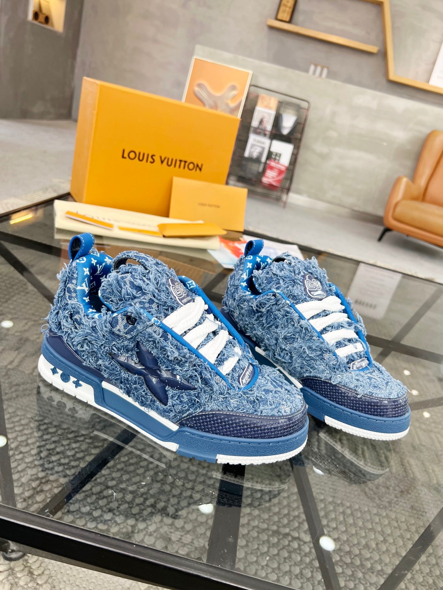 Distressed Denim Luxury Sneakers with High-End Detailing and Signature Blue Sole