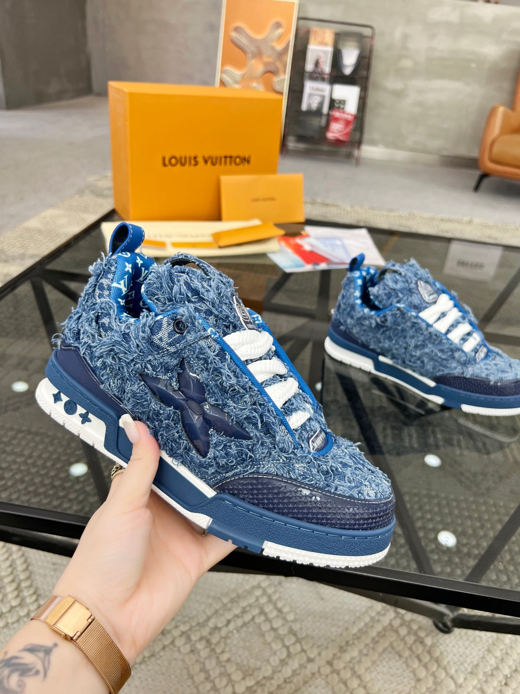Distressed Denim Luxury Sneakers with High-End Detailing and Signature Blue Sole