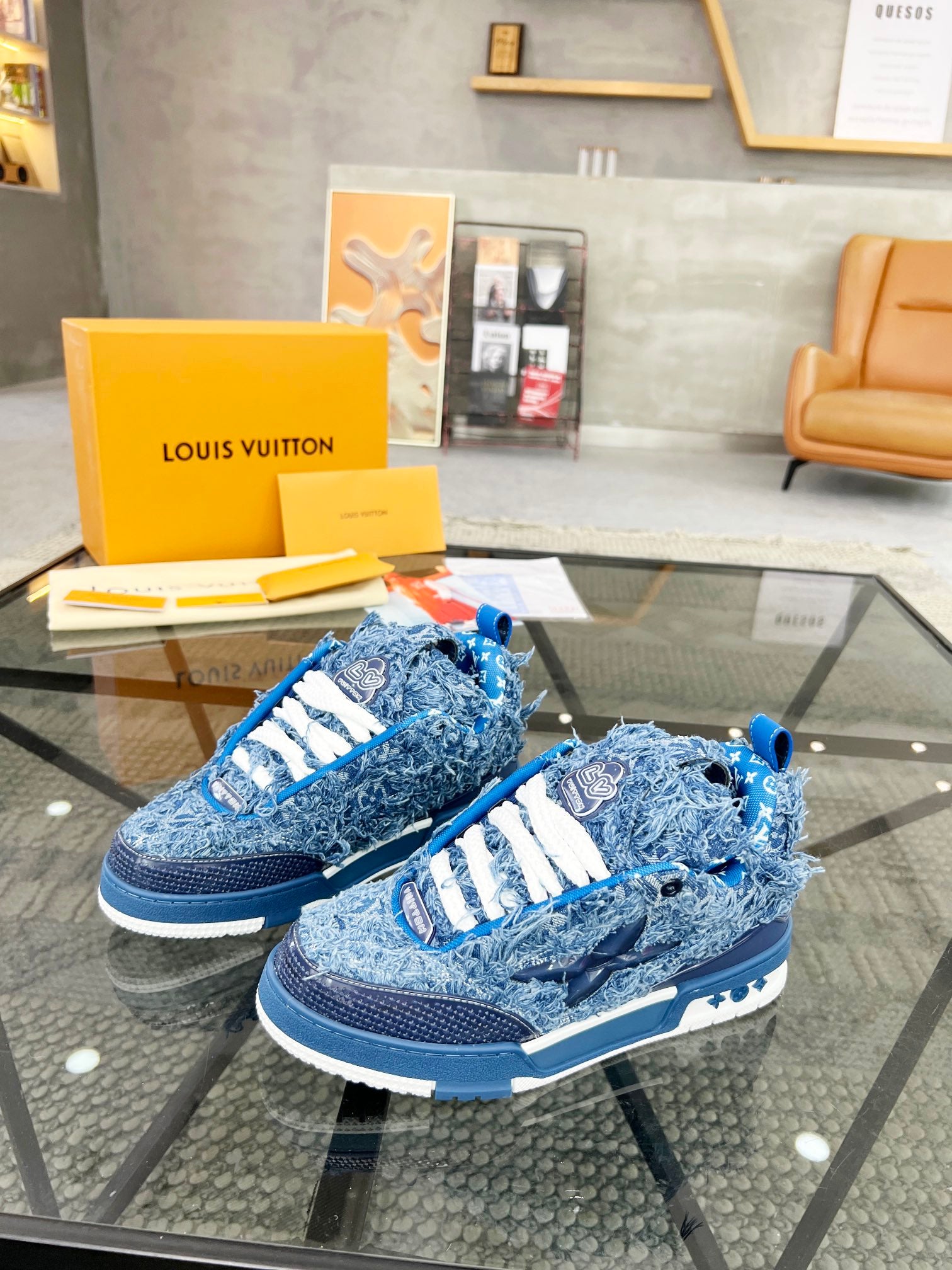 Distressed Denim Luxury Sneakers with High-End Detailing and Signature Blue Sole