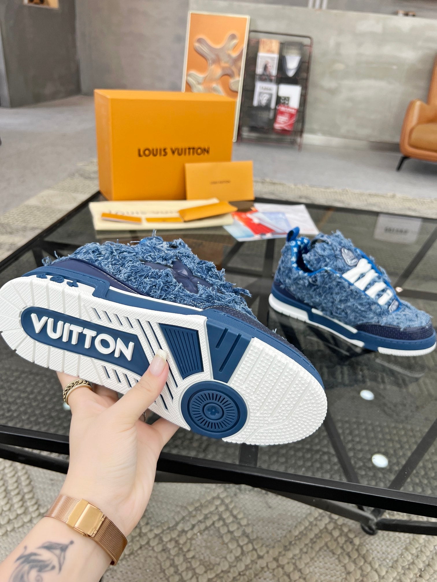 Distressed Denim Luxury Sneakers with High-End Detailing and Signature Blue Sole